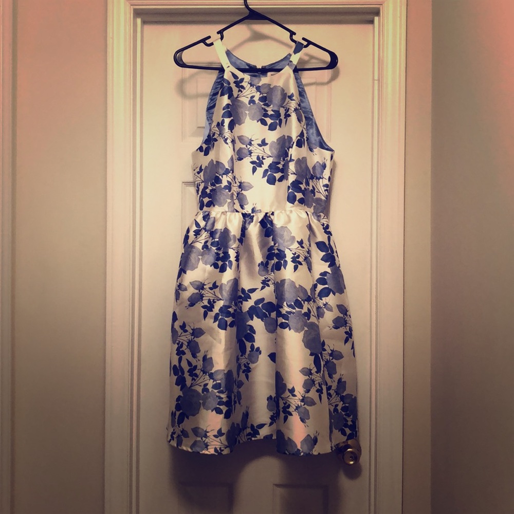 Halter fit & flare dress with blue floral pattern.